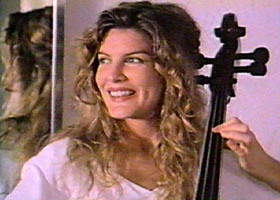 Elena (Rene Russo) smiles seeing Grishka coming in.